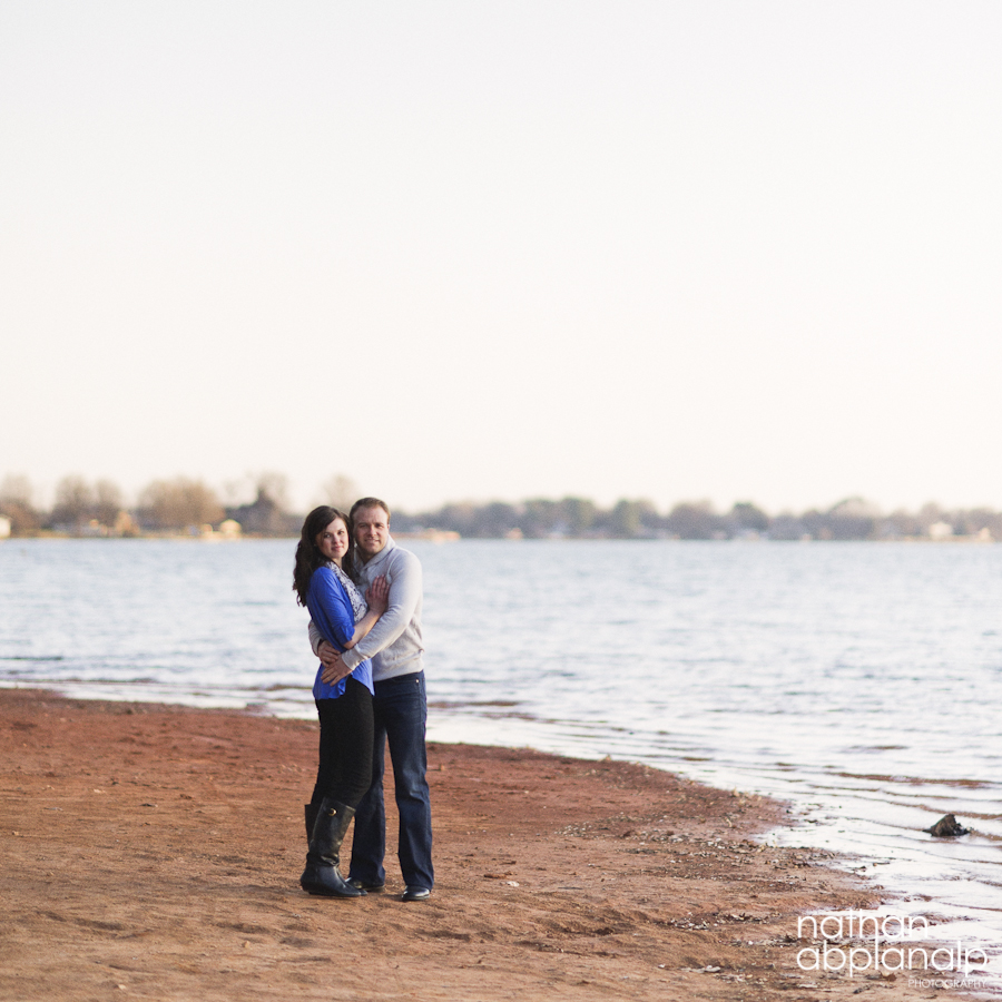 Couple hugging on the shores of Lake Norman in Charlotte NC