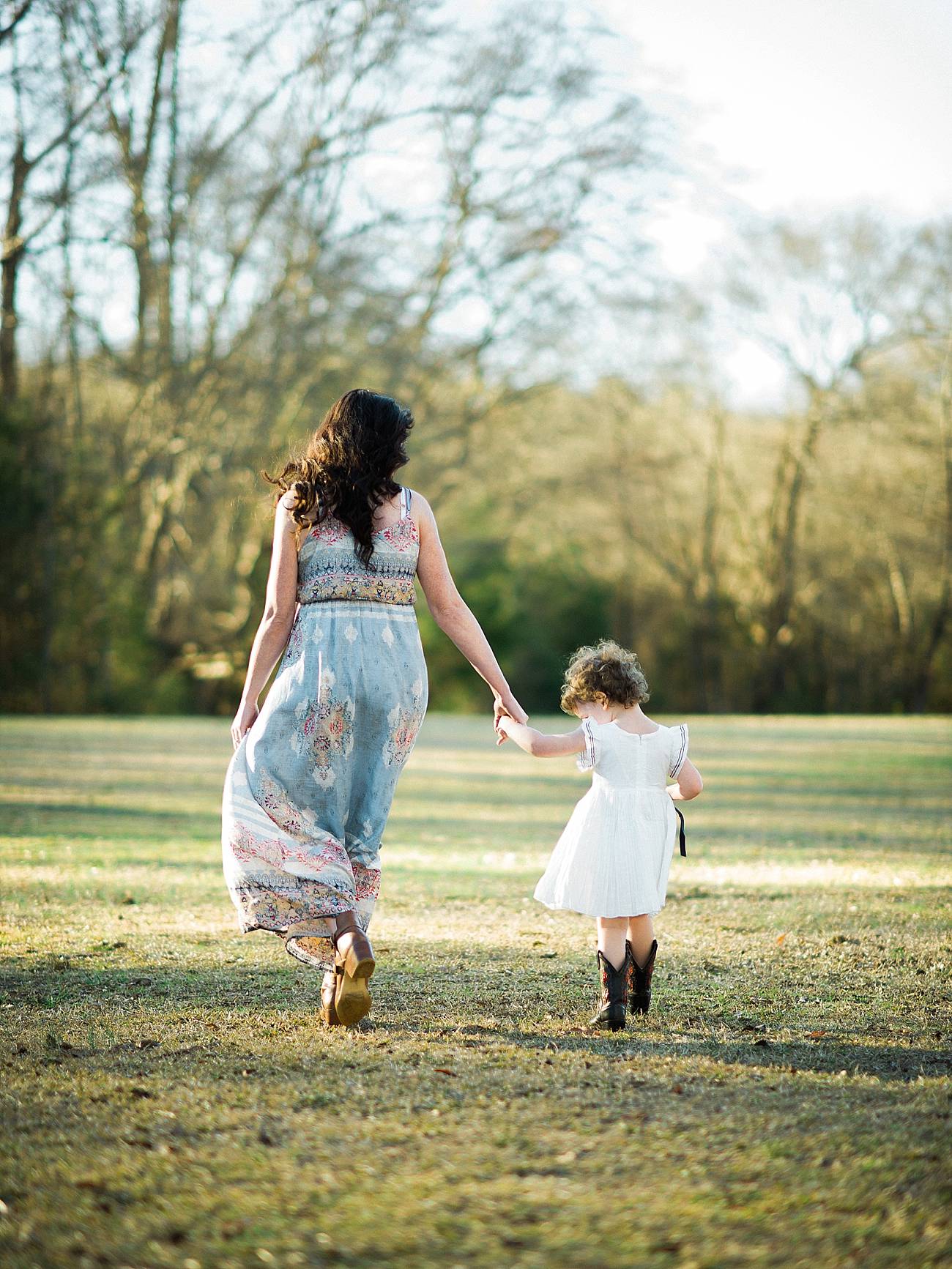 a mother and daughter walk hand in hand at Westminster Park, Rock Hill, SC