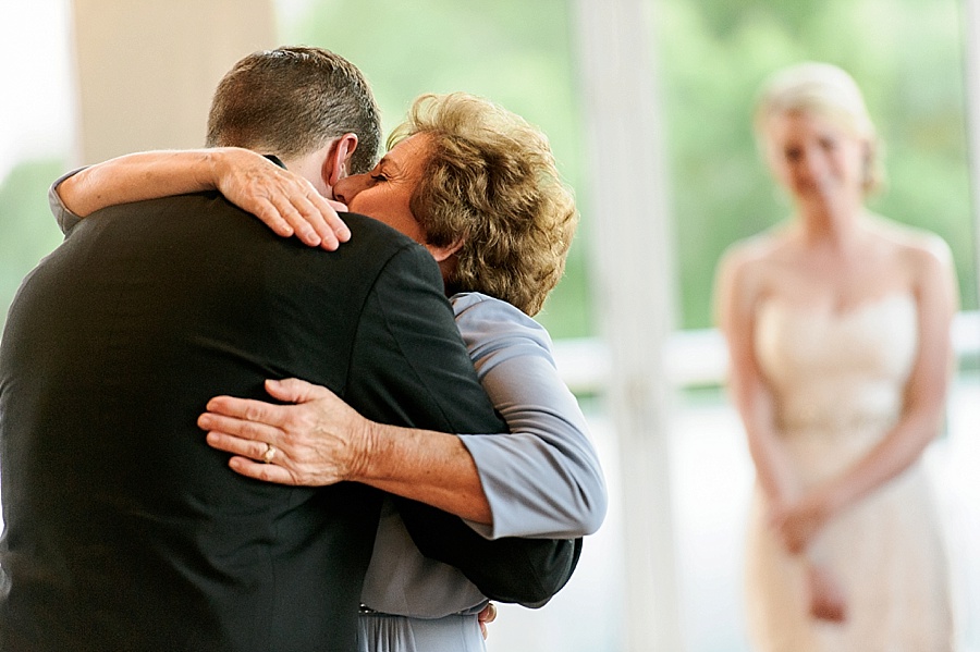 Groom and mother embrace at Foundation for the Carolinas in Charlotte NC