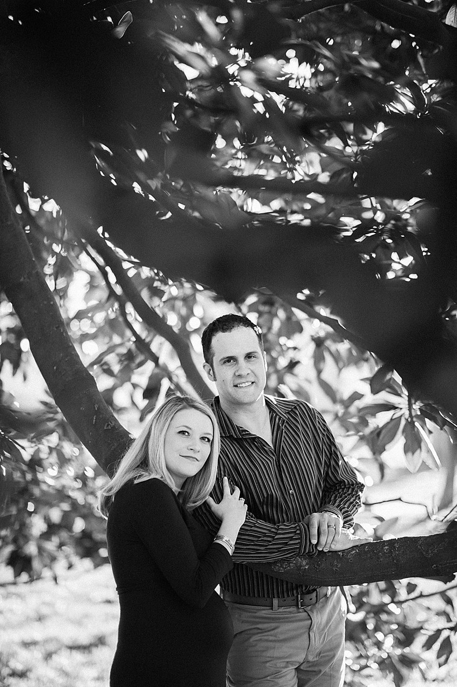 Wife leans on husband's shoulder at Independence Park in Charlotte NC