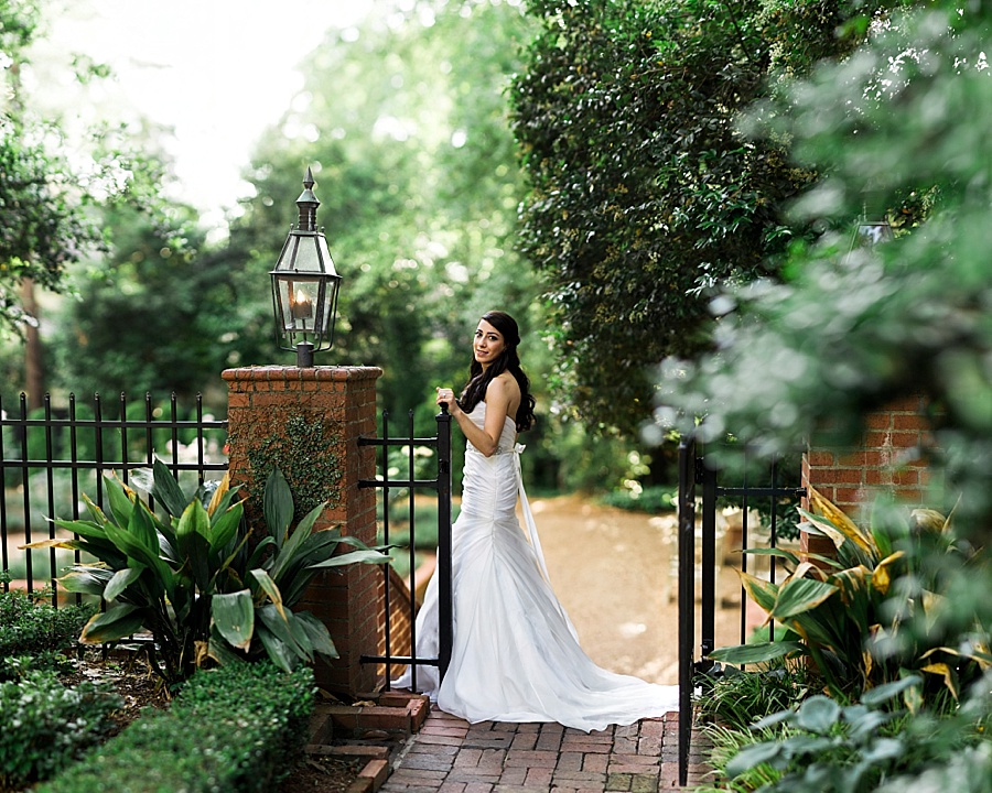 Bride at the gate at the Duke Mansion in Charlotte NC
