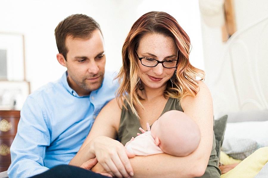 Mother and Father looking at baby in Charlotte NC