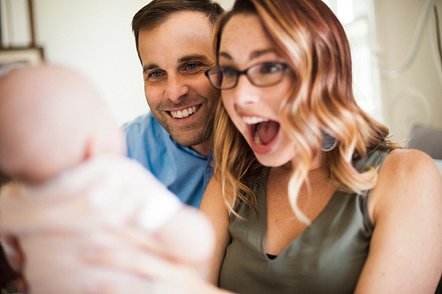 Mother and Father make faces at baby in Charlotte NC
