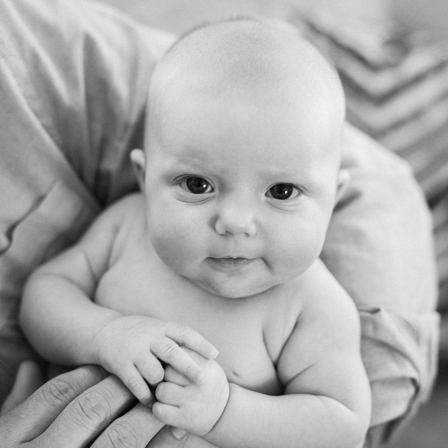 Baby in the arms of her father in Charlotte NC