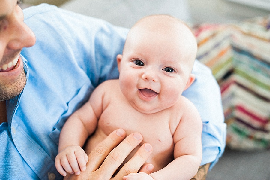 Baby in the arms of her father in Charlotte NC