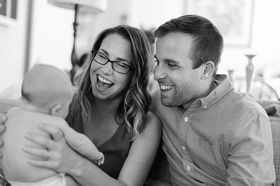 Mom and Dad smiling at baby in Charlotte NC