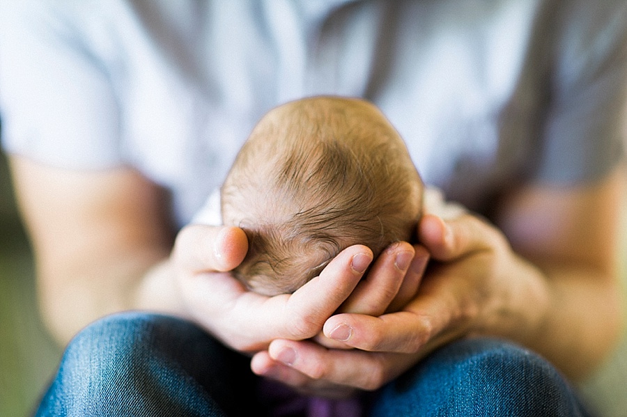 Father holding newborn baby in Charlotte NC