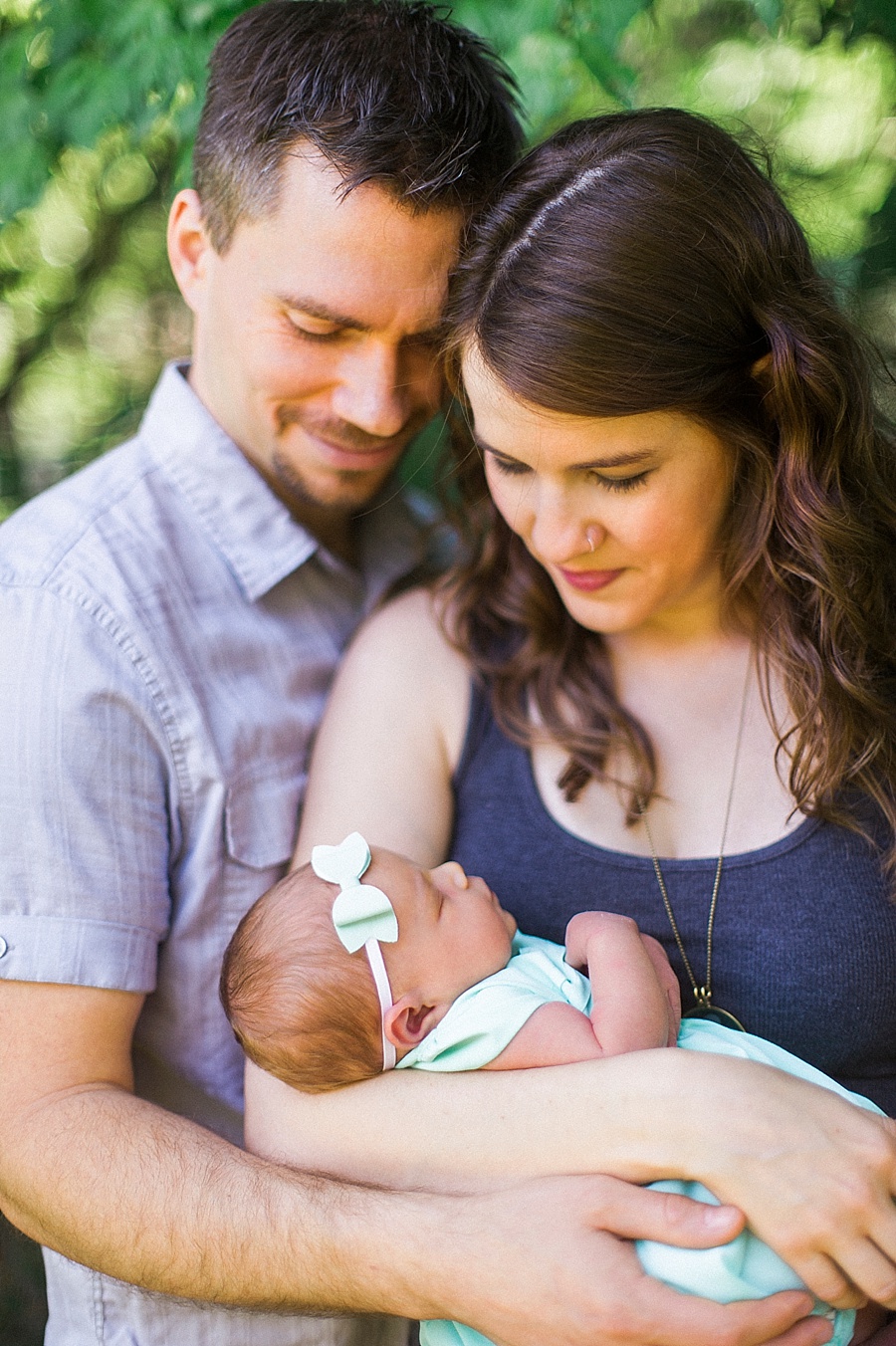 New parents look at newborn baby in Charlotte NC