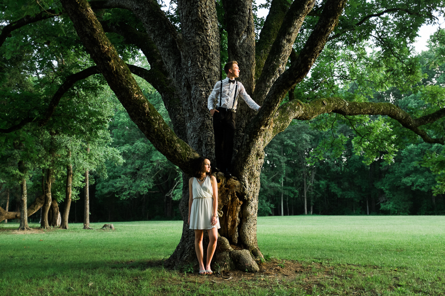 Man and woman in tree in a park in Charlotte NC