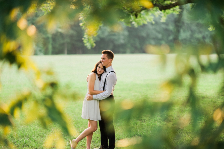Man and woman embracing in a field in Charlotte NC