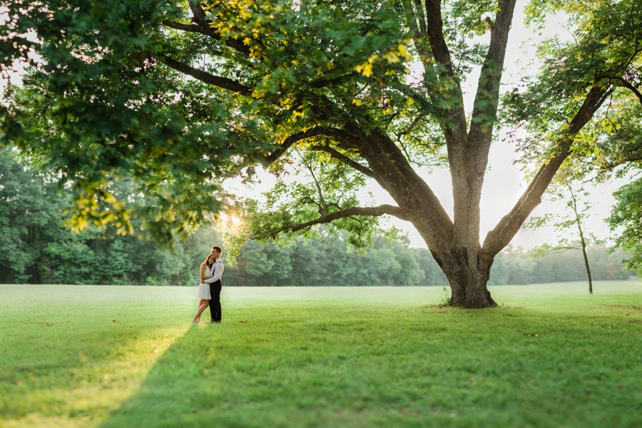 Man and woman embracing in a field in Charlotte NC