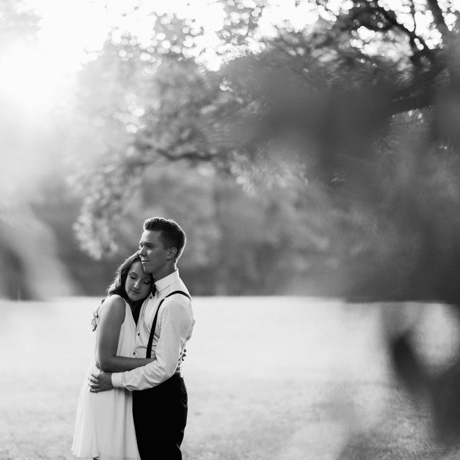 Man and woman embracing in a field in Charlotte NC