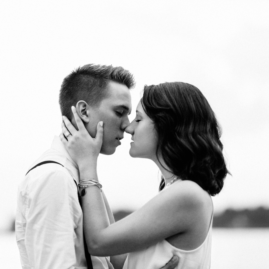 Couple kissing on the shores of Lake Wylie in Charlotte NC