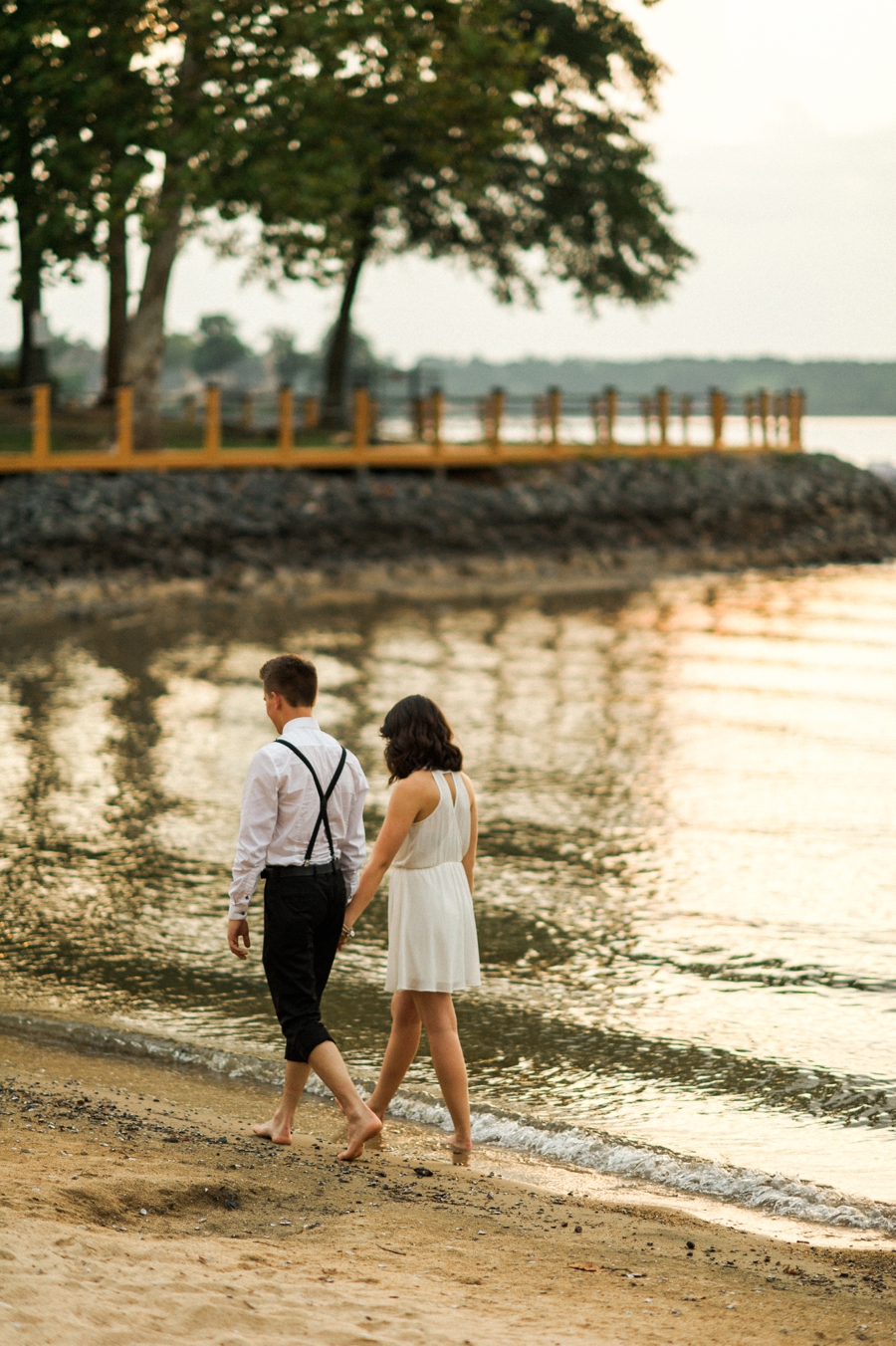 Couple walking on the shores of Lake Wylie in Charlotte NC
