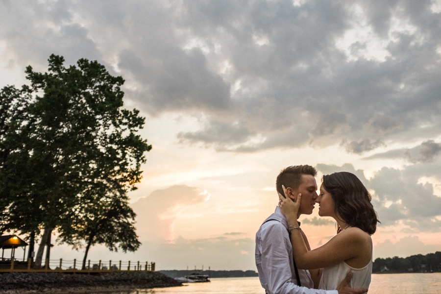 Couple embraces on the shores of Lake Wylie in Charlotte NC