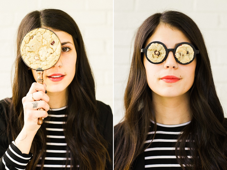 Woman with Cookie Magnify glass and cookie glass for The Cookie Cult in Charlotte NC