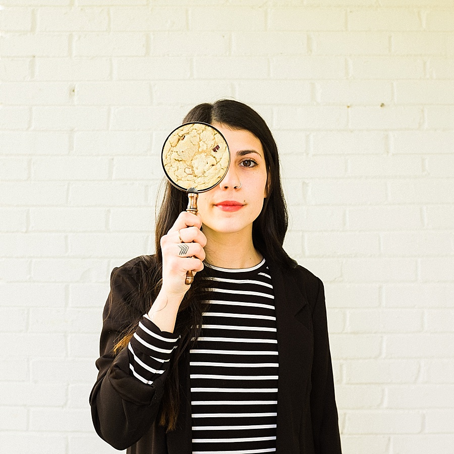 Woman with magnified filled with a  cookie for The Cookie Cult in Charlotte NC