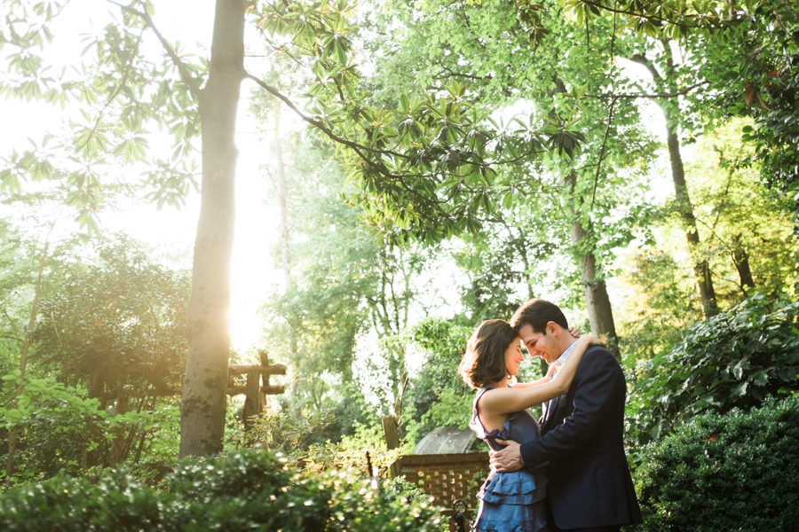 Couple hugging at Wing Haven Gardens in Charlotte NC