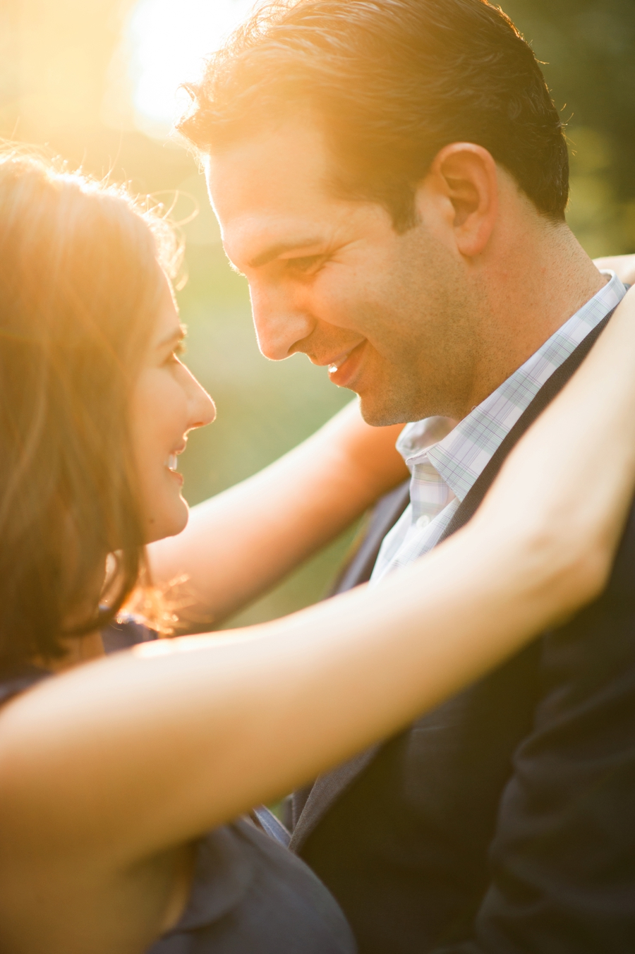 Couple looking into each other's eyes at Wing Haven Garden in Charlotte NC