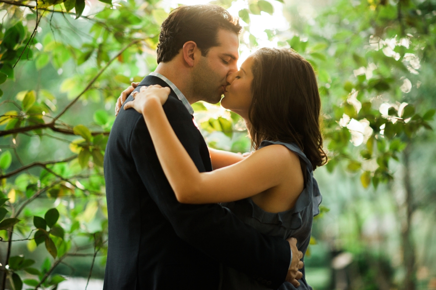 Couple kissing at Wing Haven Garden in Charlotte NC