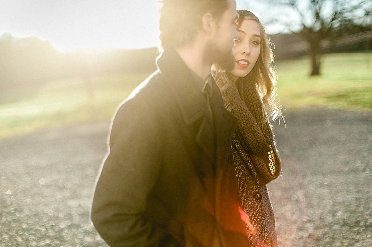 Woman looks at man with a warm sunlight glow at Ann Springs Close Greenway