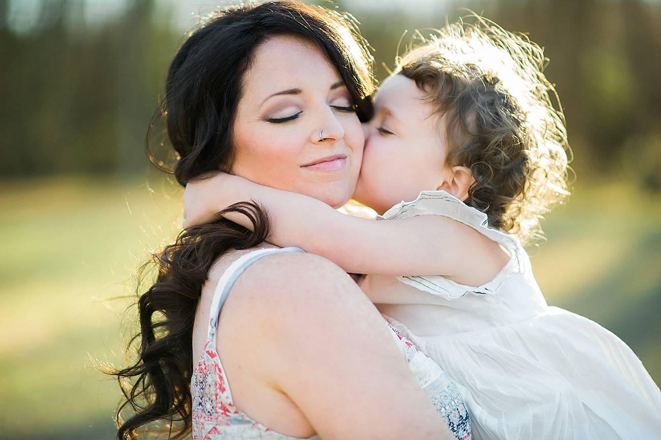 a little girl kisses her mother at Westminster Park, Rock Hill, SC