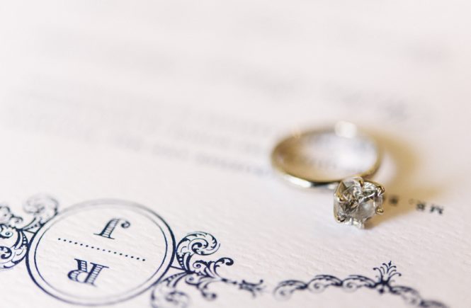 Engagement ring on a wedding invitation