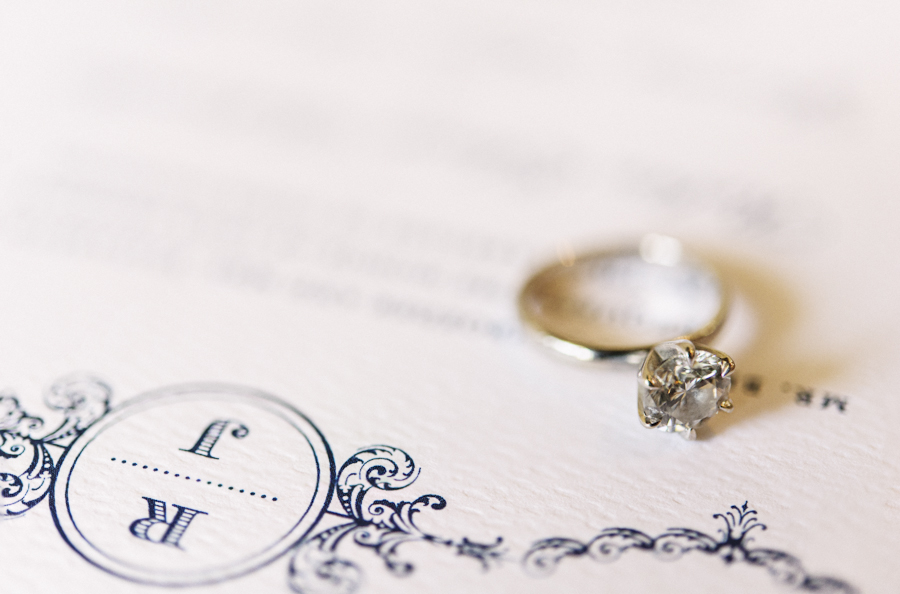 Engagement ring on a wedding invitation
