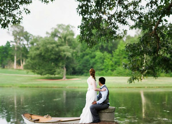 Bride and Groom by a lake at the Oaks at Salem in Apex NC