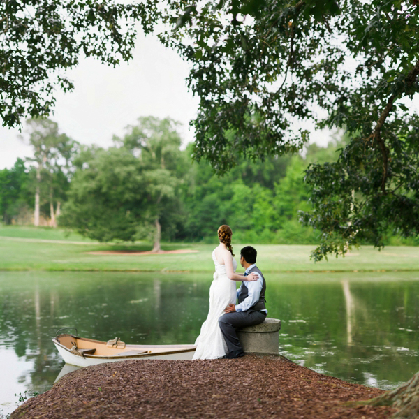 Bride and Groom by a lake at the Oaks at Salem in Apex NC