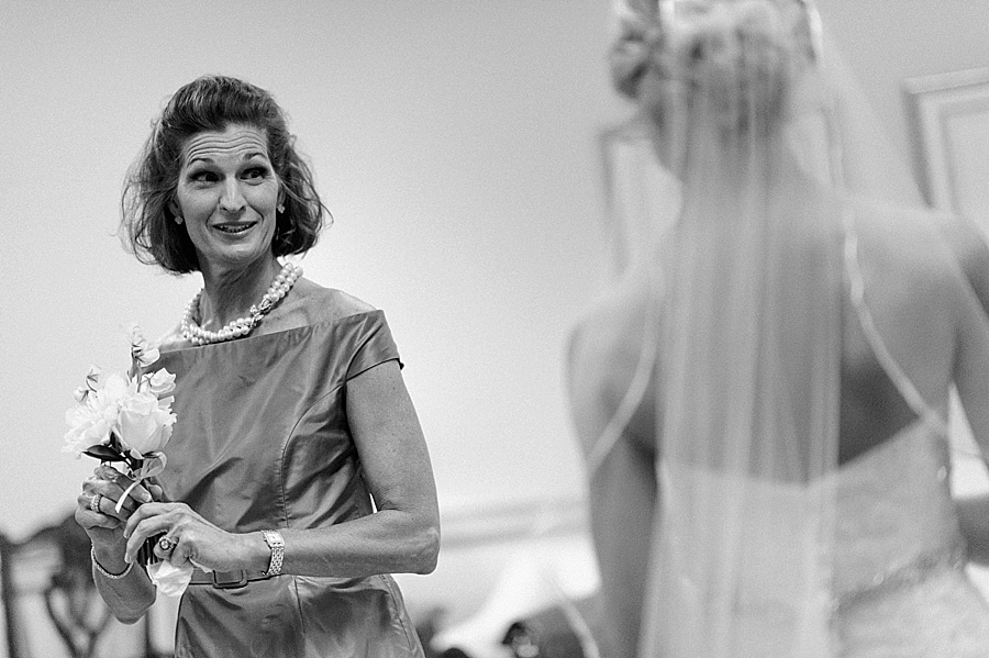 Mother glances at bride at Myers Park United Methodist Church in Charlotte NC