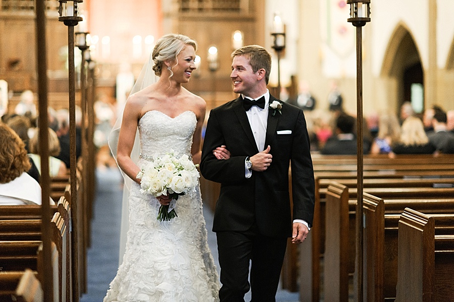 Bride and groom exit wedding ceremony at Myers Park United Methodist Church in Charlotte NC