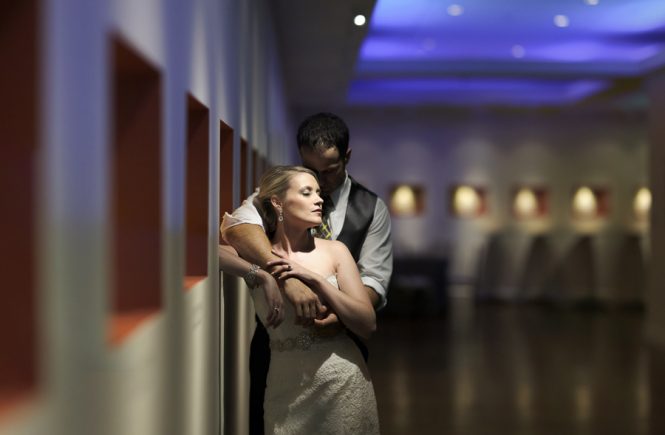 Bride and groom embrace at the Foundation for the Carolinas in Charlotte NC