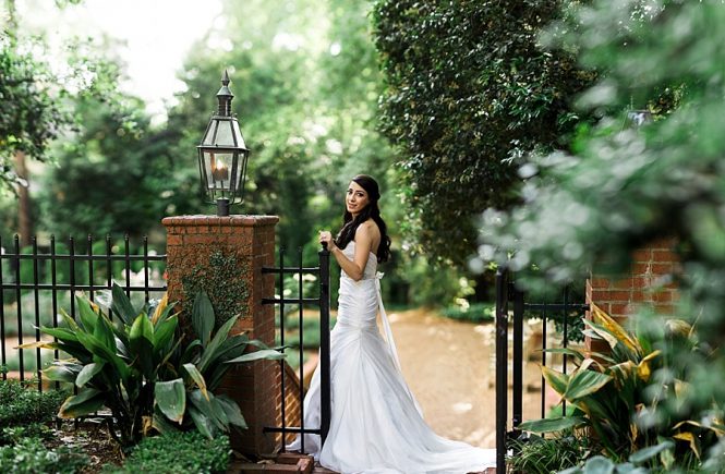 Bride at the gate at the Duke Mansion in Charlotte NC