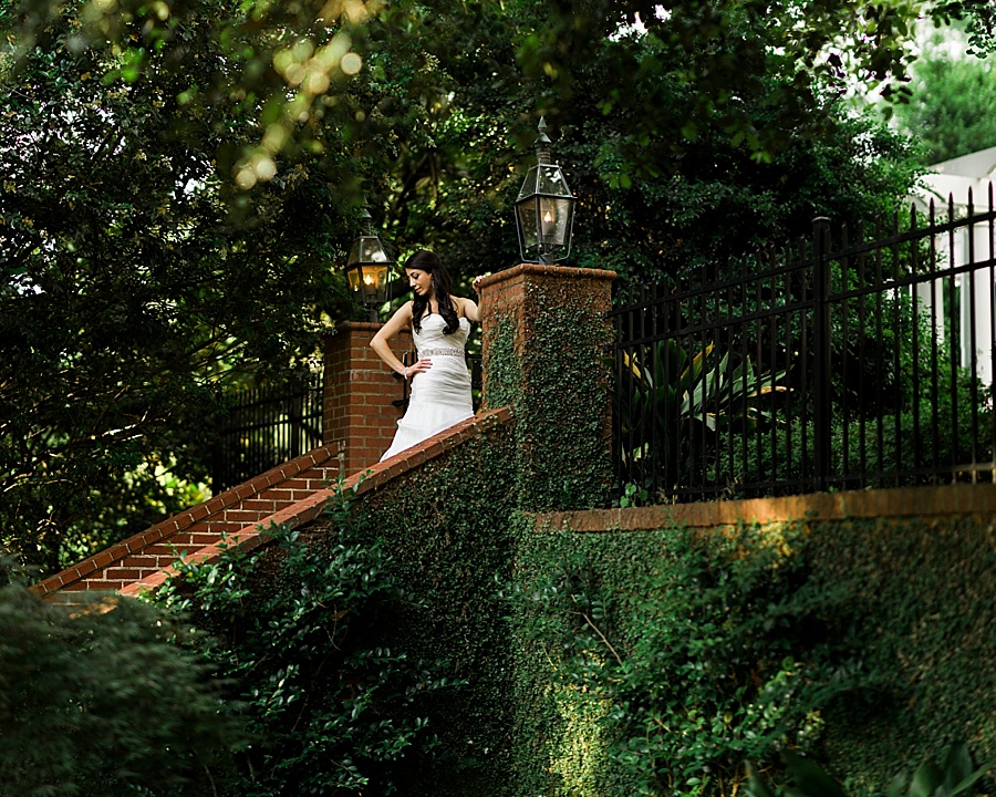 Bride on brick stairs of the Duke Mansion in Charlotte NC