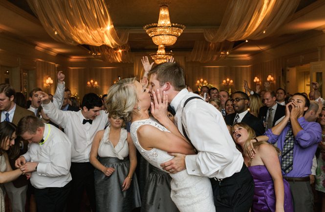 Groom kissing bride while dancing at the Carmel Country Club in Charlotte NC