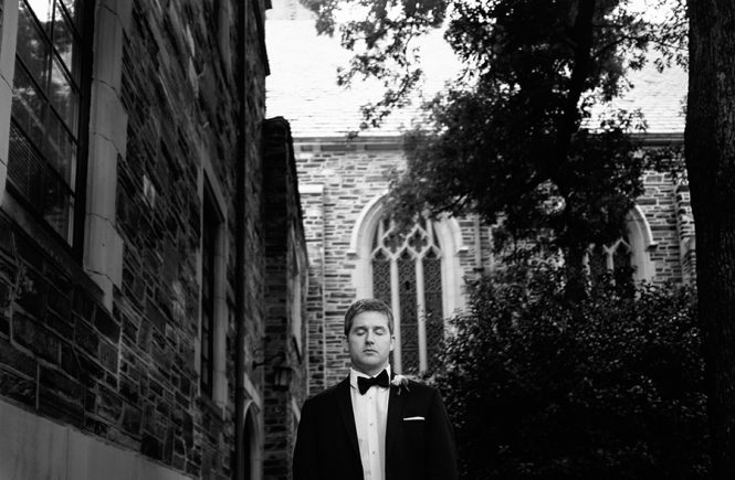 Groom with eyes shuts at the Myers Park United Methodist Church in Charlotte NC