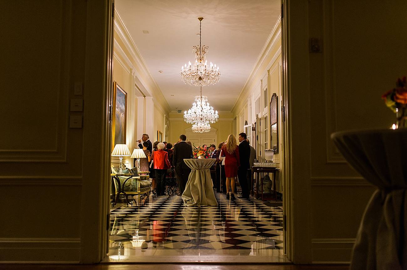 Guests mingle in the hallway of the Duke Mansion in Charlotte, NC